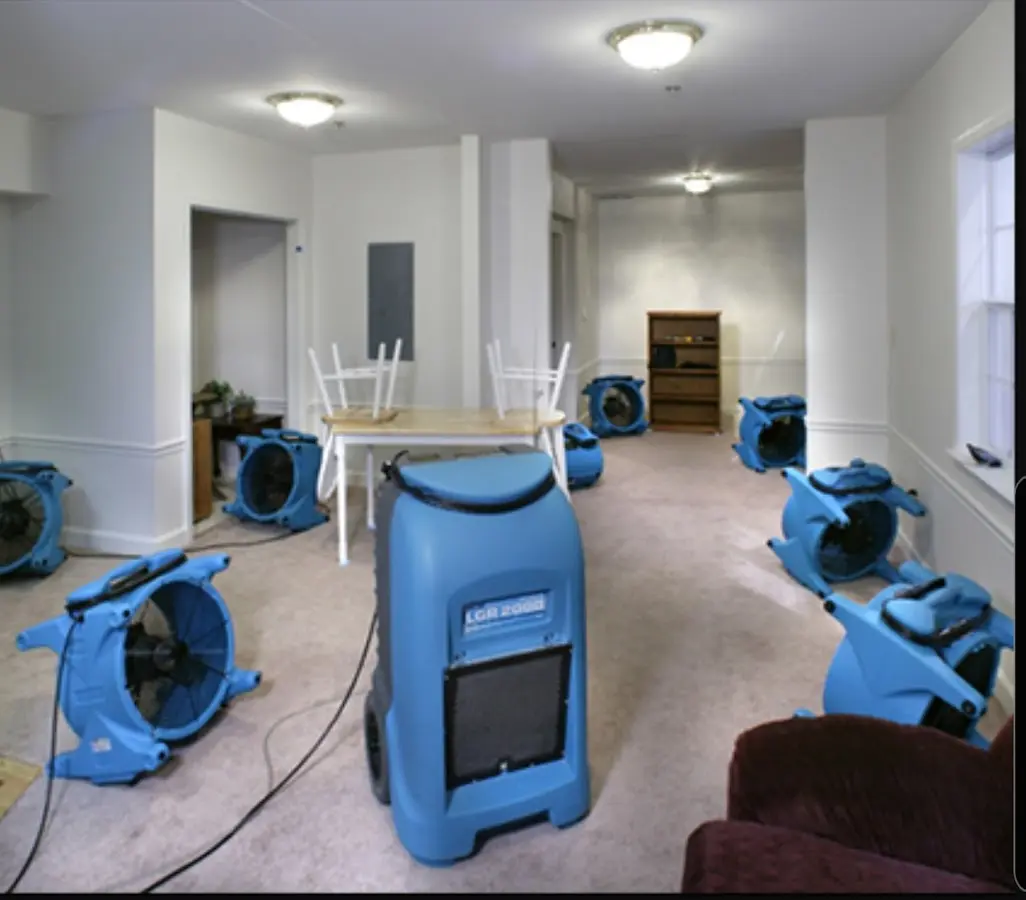Air movers and dehumidifier setup for Water Damage Restoration in Rehoboth